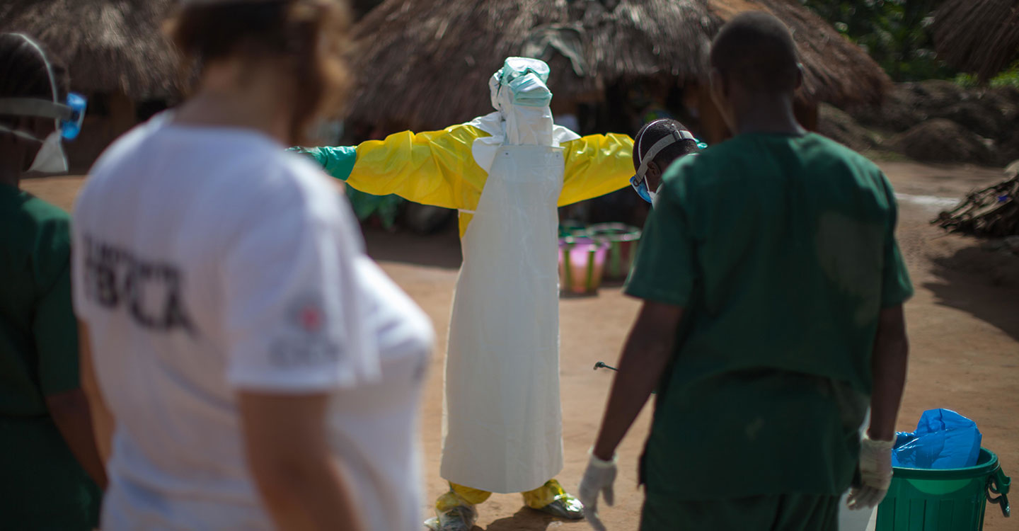 Health workers don full personal protective equipment in Guinea during the 2014-16 West Africa Ebola outbreak. Credit: Sean Hawkey