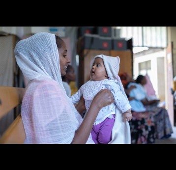 A mother and child in the Tigray Region of Ethiopia during a routine measles vaccination session in 2024. Credit: Gavi/2024/Mulugeta Ayene.