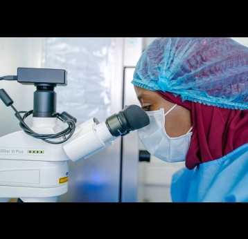 Dr Sène Marie-Angélique, Head of the Microbiology and Analytical Development Lab, looks through a microscope, at the Institut Pasteur in Dakar, Senegal, on June 16, 2022. Credit: Pasteur Institute Senegal