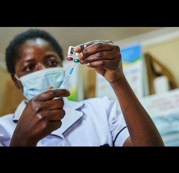 Nurse Janet Wanyama prepares to vaccinate a child against malaria at the Malava County Hospital, Kakamega, Kenya. Credit: Gavi/2021/White Rhino Films-Lameck Orina