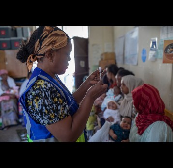 Vaccinations are prepared by a Health Extension Worker while mothers with infants await at the Umer Health Center in Shire Inda Selassie, Tigray Region of Ethiopia. Gavi/2024/Mulugeta Ayene