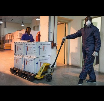Lopes Simbo stores tetanus vaccines at the central cold storage in Maputo, Mozambique – Gavi/2020/Isaac Griberg