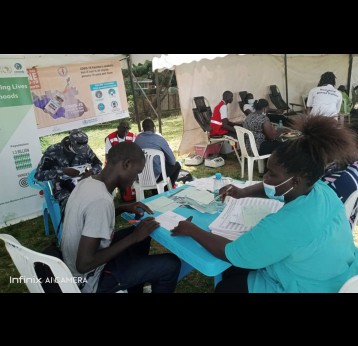 Health workers taking COVID-19 vaccination records at Nyakuron Cultural Centre – by Simon Deng 