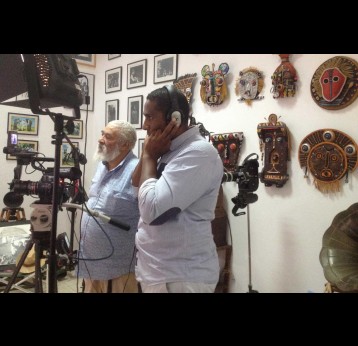 Óscar Gil next to his son in his studio – Credit: Gaspar Micolo