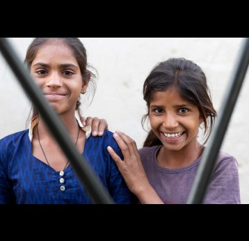  Two girls are seen in this image taken in a Village in Rajasthan, India – Gavi/2021/Benedikt v.Loebell