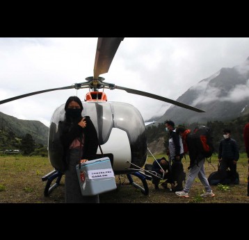 Lunana's first female health worker with the vaccine carrier that was flown into Lhedi village to conduct the second dose of COVID-19 vaccination. Photo: UNICEF Bhutan/2021/Namgay Dorji