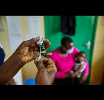 Nurse Janet Wanyama prepares to vaccinate a child against malaria at the Malava County Hospital, Kakamega, Kenya. Credit: Gavi/2021/White Rhino Films-Lameck Orina