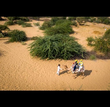 Health workers team going on camel to vaccinate children against measles and rubella during the nationwide MR campaign in Tharparkar District. Sindh province, Pakistan. Photographer: Asad Zaidi