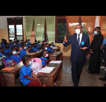 Cameroon's Public Health Minister, Malachie Manaouda, tells students to educate their parents about the vaccine during a tour of schools in Yaounde.
