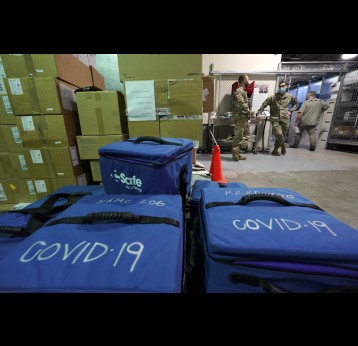Cooler bags in the Madigan Army Medical Center at Joint Base Lewis-McChord that will be used to transport vials of the first shipment of the Pfizer vaccine for COVID-19 to other locations in the hospital. Courtesy of Ted S. Warren/Associated Press.