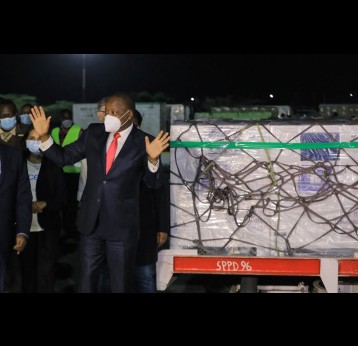 Kenya’s health minister Mutahi Kagwe next to the country’s first batch of COVID-19 vaccines at the Jomo Kenyatta International Airport. EPA-EFE/Daniel Irungu