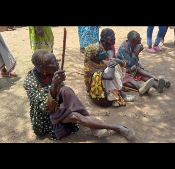 Villagers in Logloko village, Marsabit, listening to COVID-19 vaccine education and information sharing session.