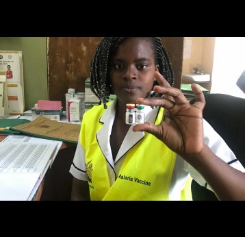 A nurse shows the new malaria vaccine.