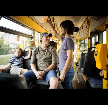 Passengers in the city bus, talking without masks