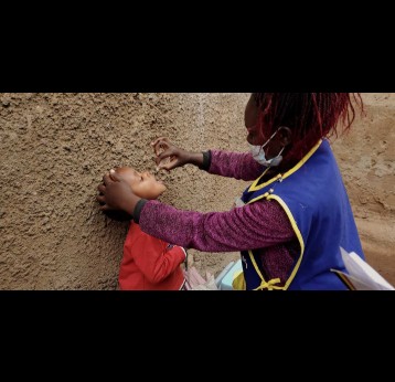 A child gets oral polio vaccine.