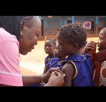 A schoolgirl receives a dose of HPV vaccine in Sierra Leone. Credit: Gavi/2022/Joshua Kamara