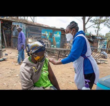 A SHOFCO health worker administering COVID-19 vaccines in Kibra slum during a mass vaccination exercise. Photo courtesy of SHOFCO