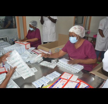Revital workers inspecting packaged materials ready to be exported to Tanzania to fight the COVID-19 pandemic