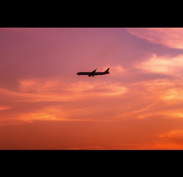Plane in the twilight sky. Photo by Ramy Kabalan on Unsplash