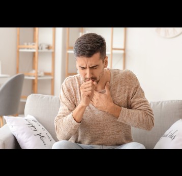 Coughing man at home