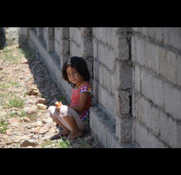 A little girl on one of the rural streets in Surkhandarya District. Credit: U.Maniyazova