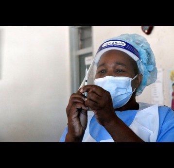 A nurse preparing a Covid-19 vaccination at Wilkins Hospital in Harare, during a nationwide integrated vaccine that bundled HPV, COVID-19 and tetanus immunisation. Credit: Annie Mpalume