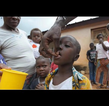 A nurse gives gives medicine, Ivermectin, against onchocerciasis or river blindness. Credit: Issouf Sanogo/AFP via Getty Images