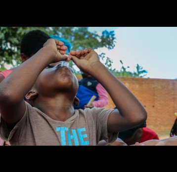 A child taking oral cholera vaccine in Malawi. Credit: Gavi/2018