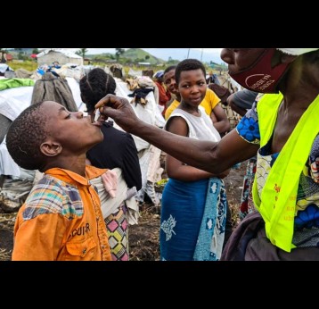 A child receiving oral cholera vaccine. © WHO / Eugene Kabambi