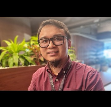 Henry Surendra in his office at Monash University, Indonesia. Credit: Dyna Rochmyaningsih