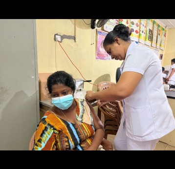 A soon to be mother gets vaccinated. Credit: Aanya Wipulasena 