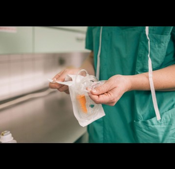 Doctor handles sterile equipment. Credit: Amparo Garcia, Shutterstock