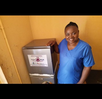 Health worker with HAF sponsored refrigerating set for hepatitis B vaccine at a pilot health centre in Delta. Credit: Hepatitis Advocacy Foundation (HAF)