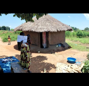 Monica Dawaru from Ocevu village in Tilevu parish Arua disrict showing her vaccination card. Credit: John Musenze