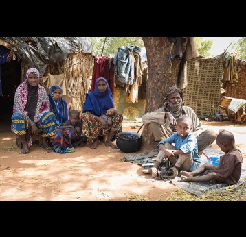 A family sit outside their home in Niamey, Niger. Gavi/Niger/Isaac Griberg