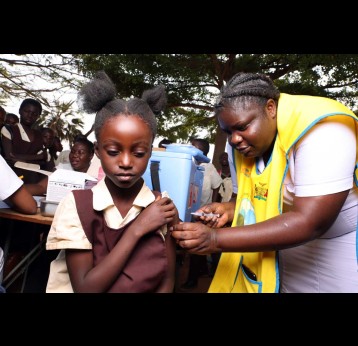 A health worker administers the HPV vaccine to a girl in Zambia. Credit: Gavi/2023/Peter Caton