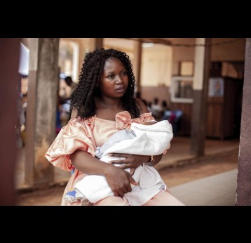 Helen Akono with one of her twins during the malaria vaccine introduction in Cameroon, a year ago. Credit: Gavi/2024/Go'tham Industry