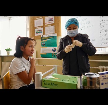 A girl receiving her HPV vaccination from a health worker in Mongolia. Credit: Gavi/2024/Khasar Sandag.