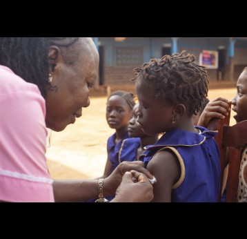Sierra Leone makes HPV vaccine available to girls across Sierra Leone, vaccinating more than 150,000. A pupil at War Wounded Primary School in Grafton District, receives her vaccination. Credit: Joshua ​Kamara