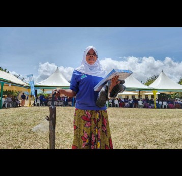 Chiku Abdallah, a Community Health Worker (CHW) holds her working tools shortly after her graduation under the Integrated Community Health Workers Program in Lindi Region. Credit: Ministry of Health Tanzania