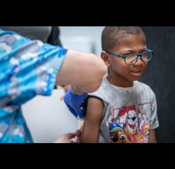 Xerius Jackson, age 7, gets an MMR vaccine during the Texas measles outbreak in March 2025. Jan Sonnenmair via Getty Images