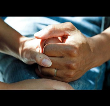 Holding hands. Credit: National Cancer Institute/Unsplash
