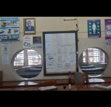Kalingalinga Health Centre reception area, with empty in-patient ward in the background. Credit: Fiske Nyirongo