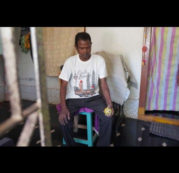 Madanala Giridhar Rao exercises with a stress ball as advised by doctors to improve blood flow to his arm and keep the vein used for dialysis strong. Credit: Kanika Gupta