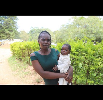 Ms Mercy Akoth at the Rangwe Subcounty Hospital with her six month old baby ahead of vaccine administration. Credit: George Omondi