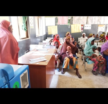 Mothers immunise their children at Panshekara PHC. Credit: Afeez Bolaji