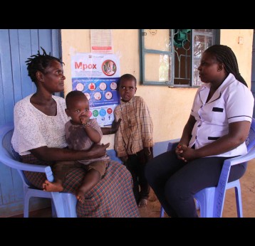 Nurse Catherine Ndanu discusses health matters with a young mother at Kiboko Dispensary. Credit: James Karuga
