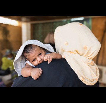 A mother brings her child to get vaccinated at a health centre in Niamey, Niger. Credit: Isaac ​Griberg