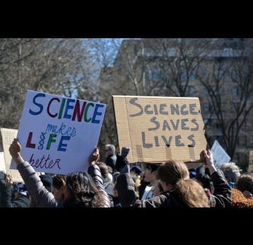 Protesters marching at a Stand up for Science rally against cuts to scientific research. Credit: Christopher Penler/ Shuttershock