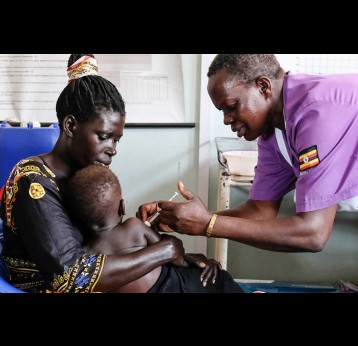 Baby receives vaccination. Credit: Project Syndicate 